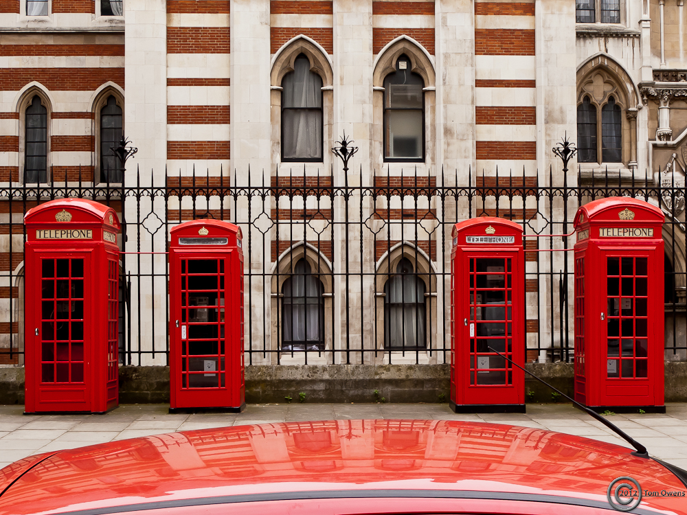 4 red telephone boxes, red car roof