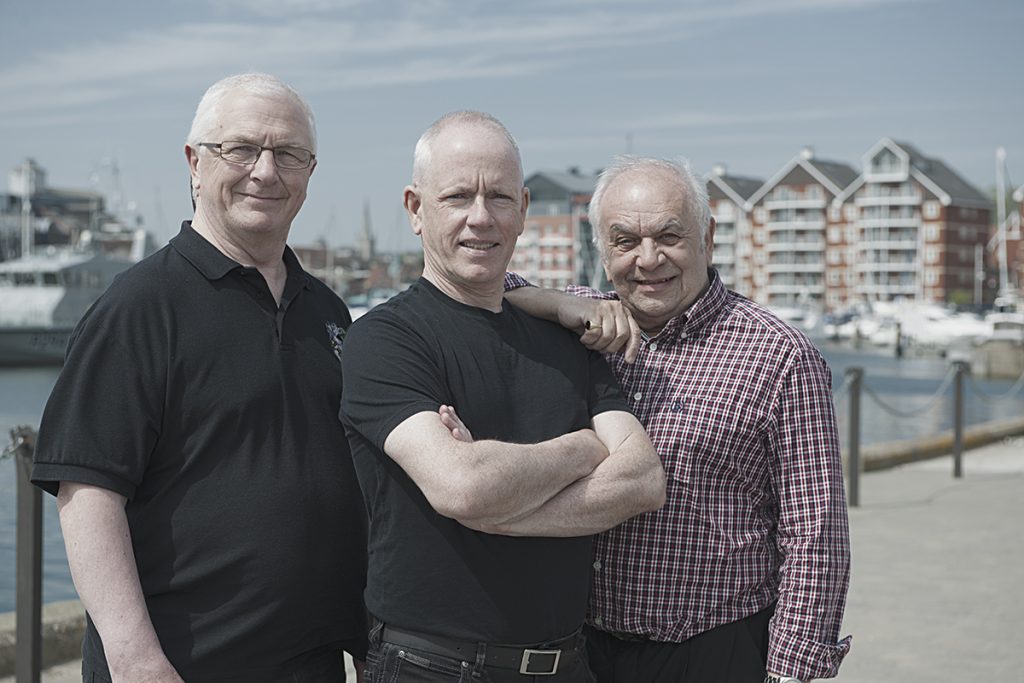 Three old men in the sun