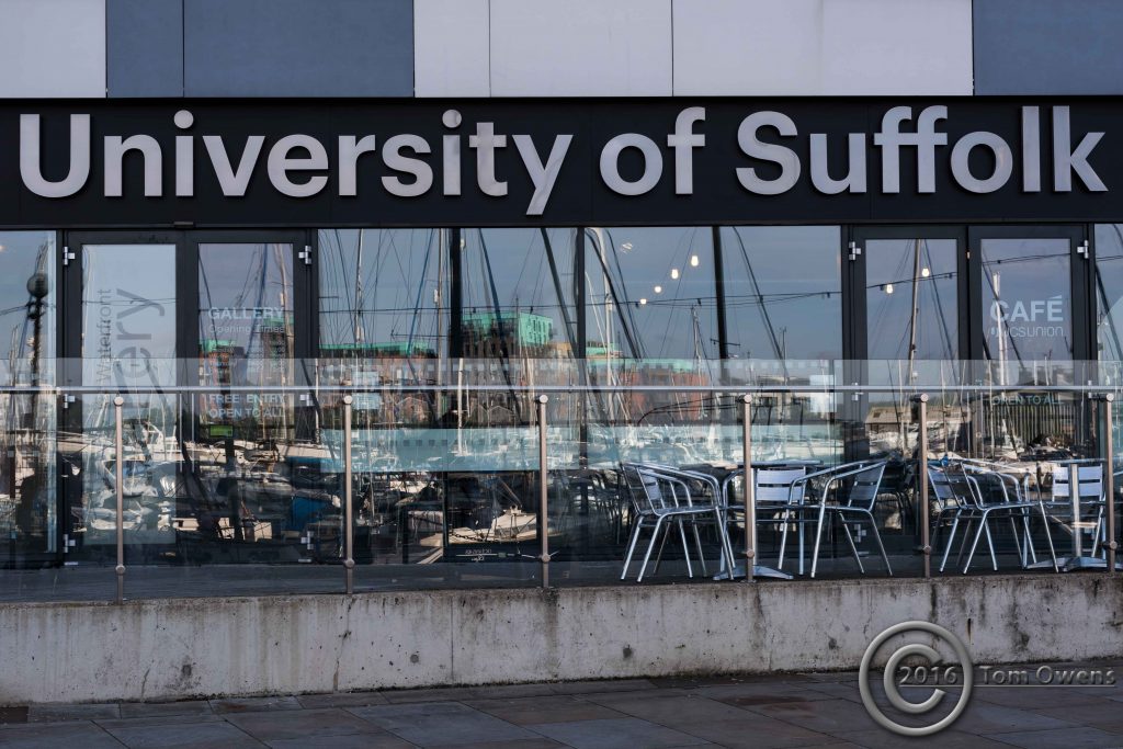 Tables chairs on the waterfront, reflections