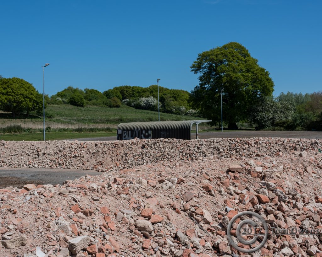 Rubble bunds with inaccessible bike shed